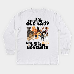 Never Underestimate An Old Lady Who Loves Dogs And Was November Kids Long Sleeve T-Shirt